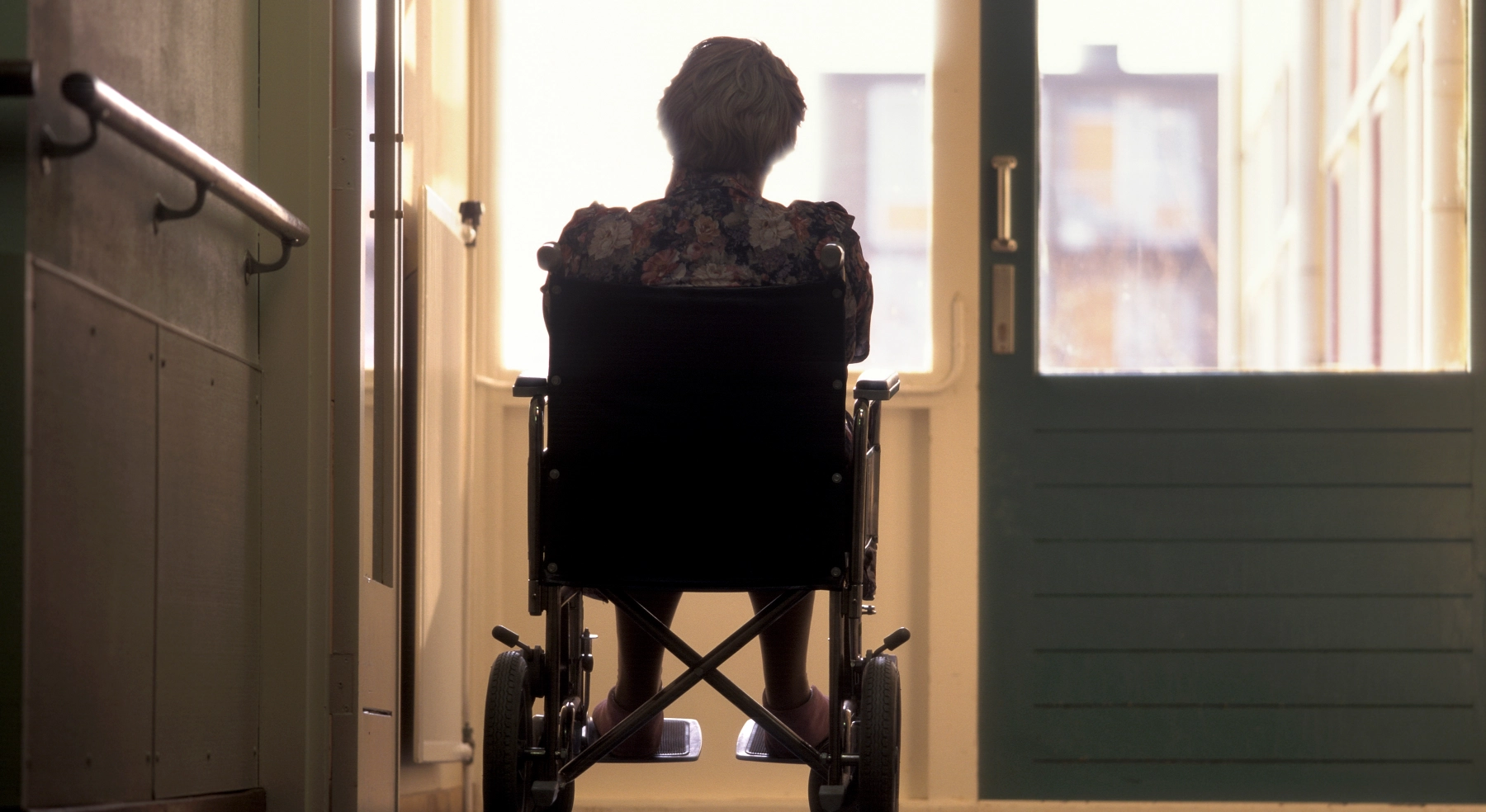 elderly person in a wheel chair alone
