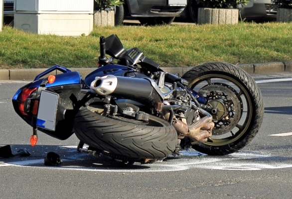 motorcycle on its side in the road